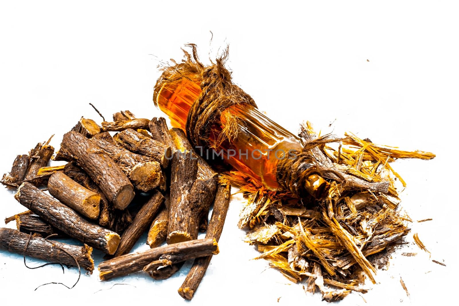 Ayurvedic herb Liquorice root, Licorice root, Mulethi or Glycyrrhiza glabra root and its powder with its oil for detoxifying the body, soothing spasms, easing menstrual cramps, raising blood pressure.