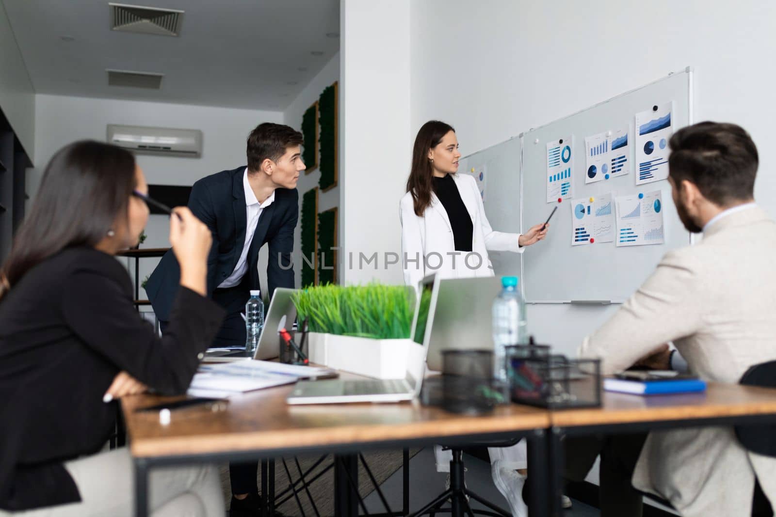 business negotiations in the office of a large company at the blackboard and flipchart.