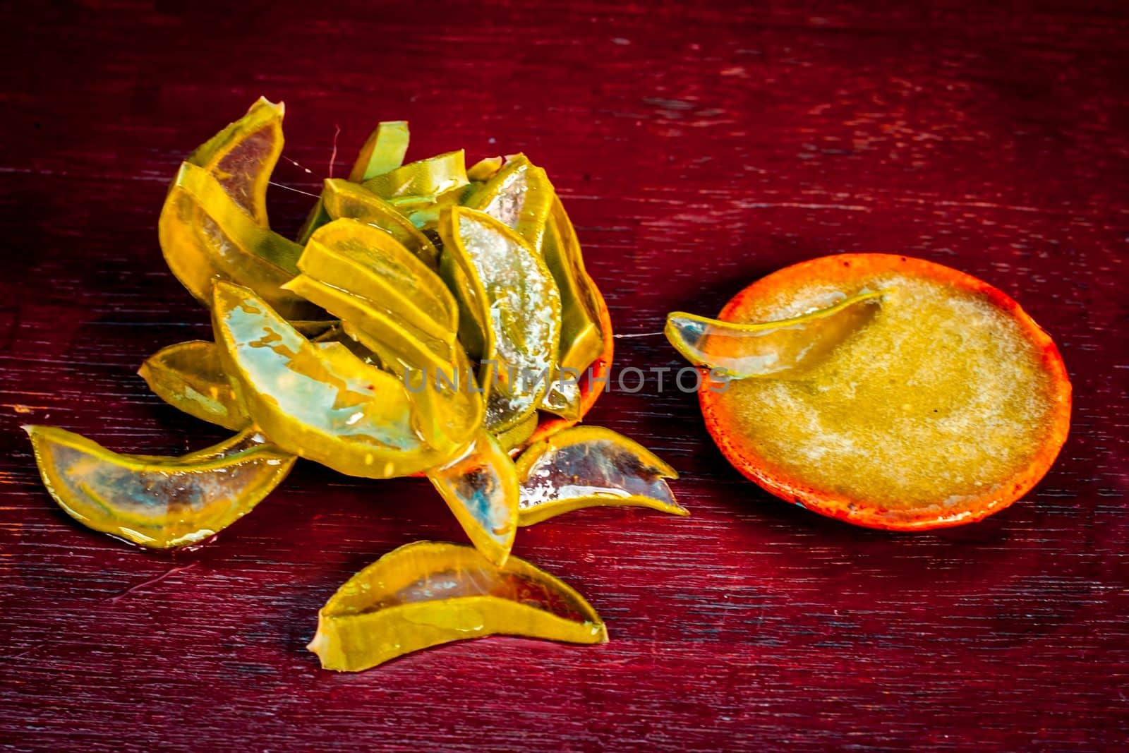 Close-up of ayurvedic face pack for removing black skin and acne with its ingredients i.e. Cucumber sliced and Aloe Vera with its gel on a brownish surface in dark Gothic colors. by mirzamlk