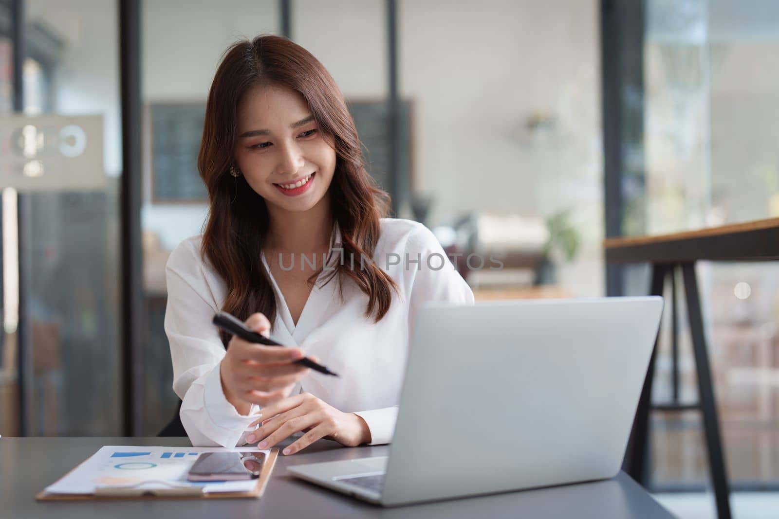 Portrait of business accountant using laptop for analyze financial data. finance, tax, accounting concept by itchaznong