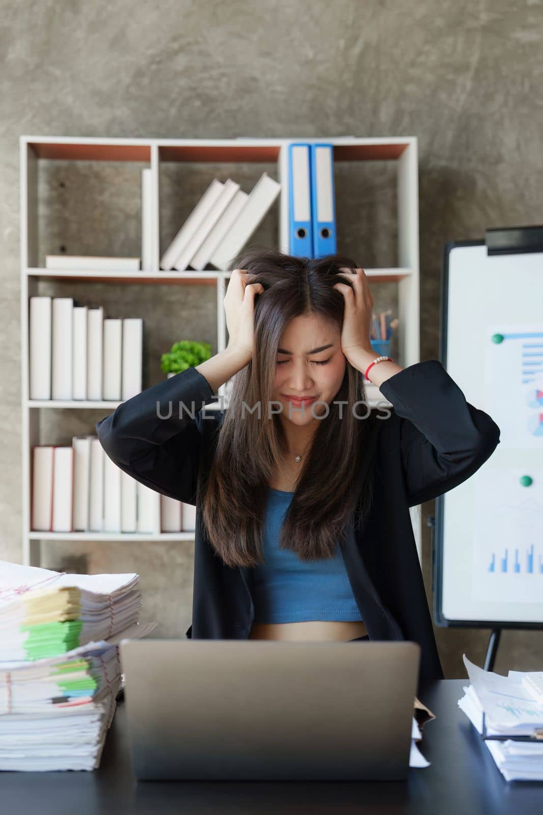 Stressed overwhelmed business person feels tired at corporate meeting, stress at work or migraine concept.