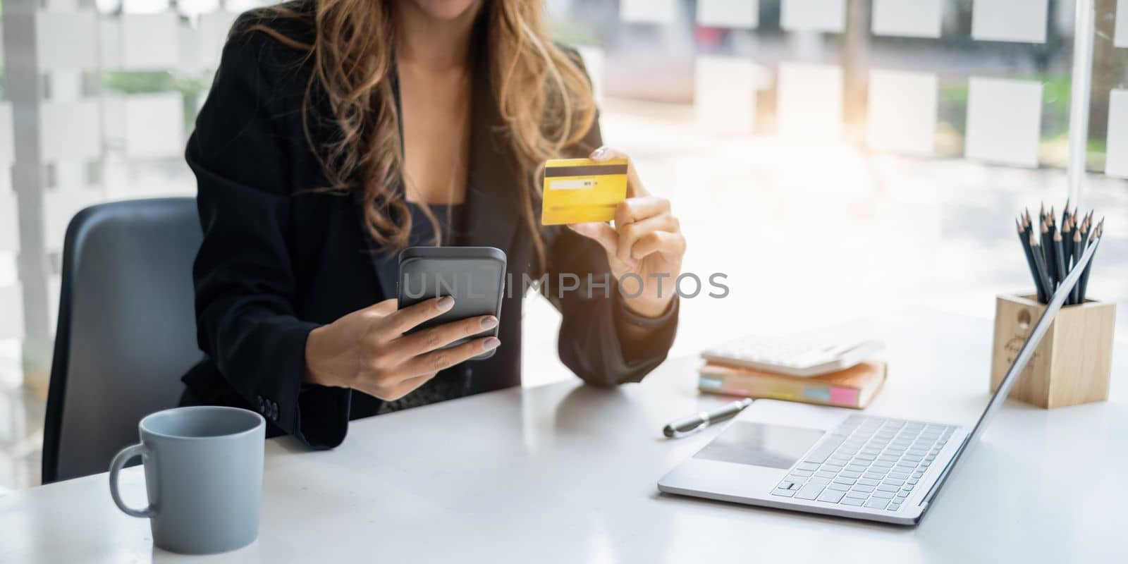Woman using shopping application on smartphone and payment by credit card