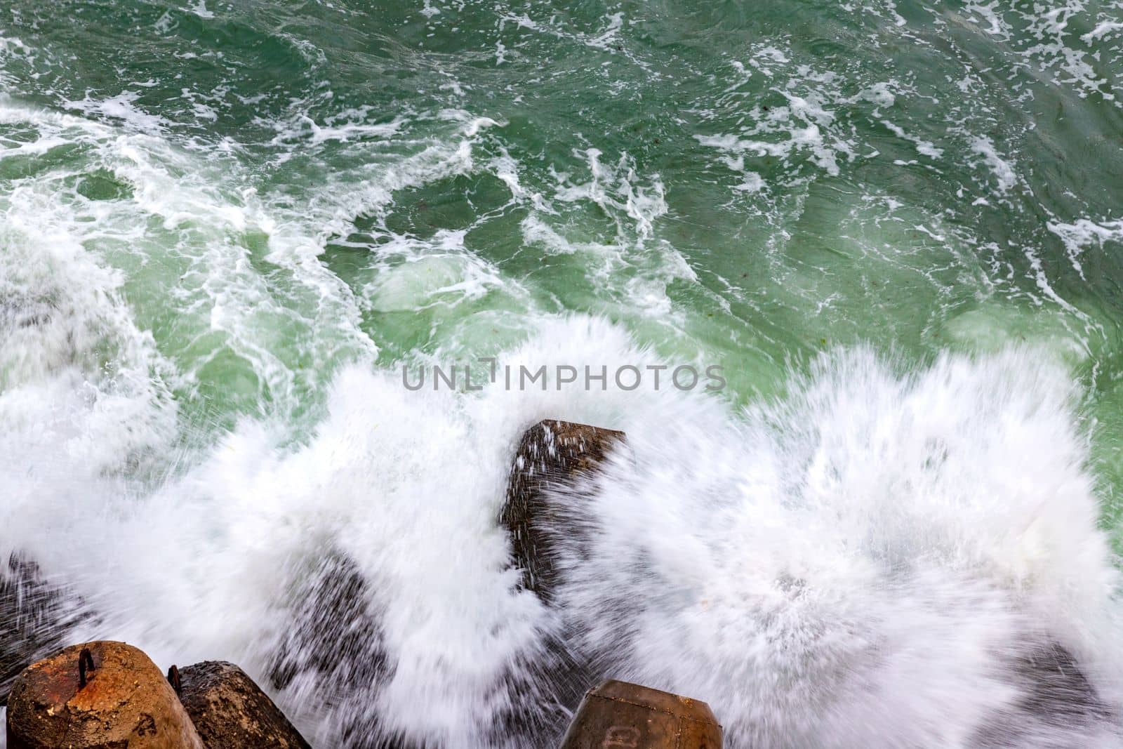 Sea waves smashed on rocks. Top view