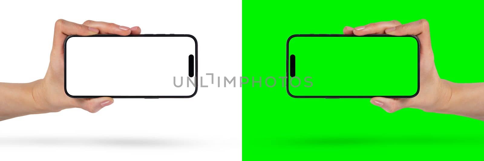 Phone in hand on a white background. A woman's hand holds a new modern phone in her hand on a white background with a blank white screen. Smartphone isolated on green background with green screen. by SERSOL