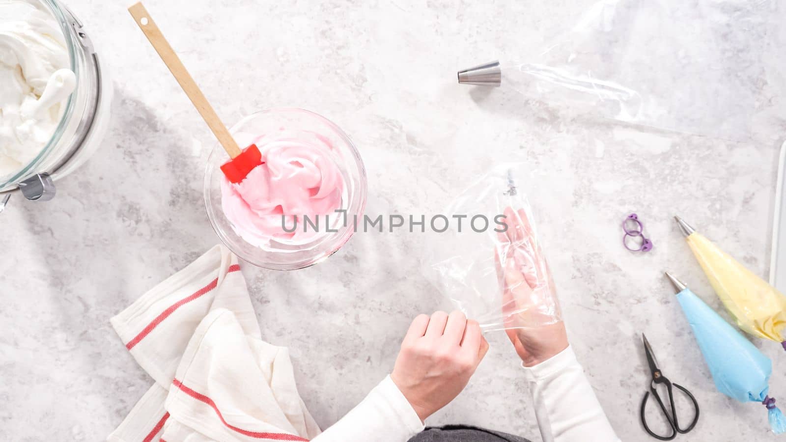 Flat lay. Step by step. Transfering meringue mix into piping bags with metal tips to bake unicorn meringue pops cookies.