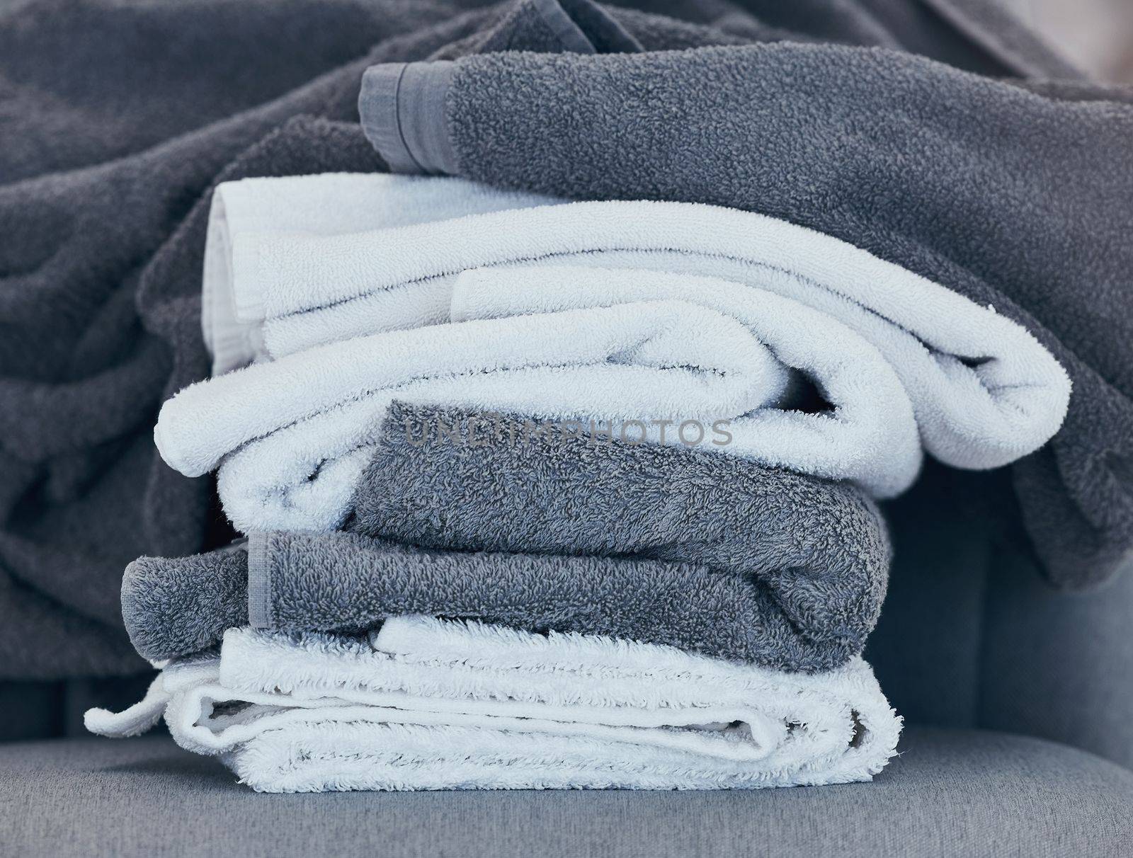 Towels, clean and laundry with texture and fabric for cleaning and hygiene in hospitality or home. Fresh washing, cleaning service or household maintenance closeup with cotton towel and textures. by YuriArcurs