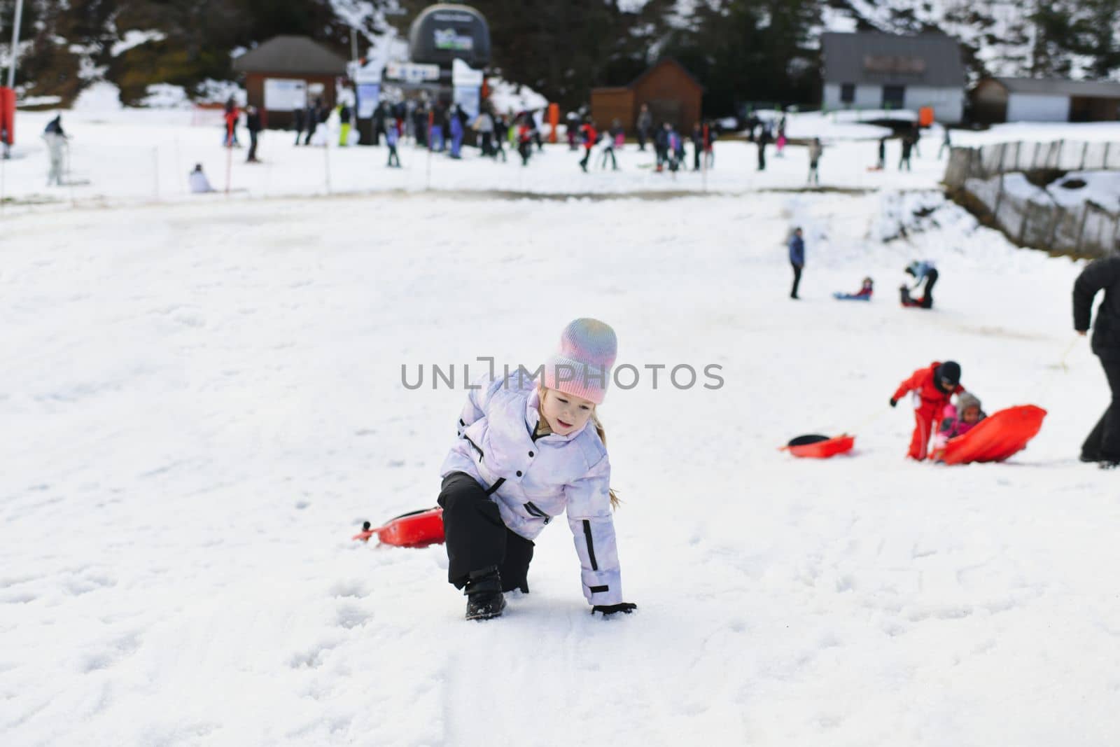 A girl with bob sledding in the snow