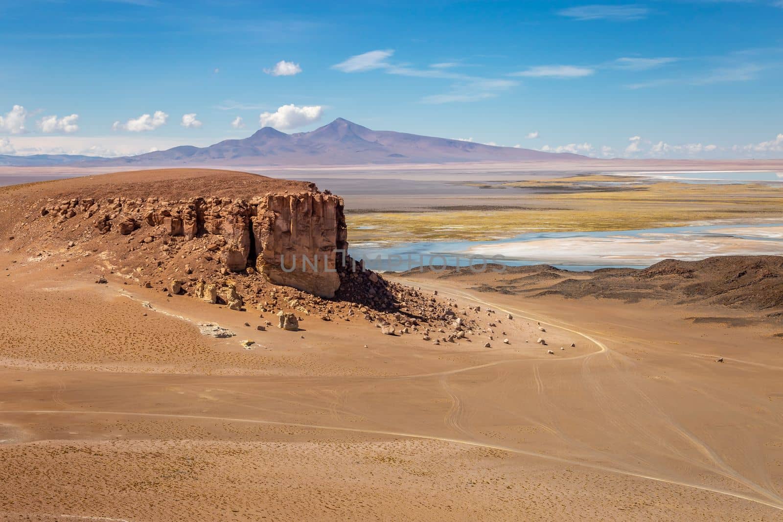 Salt lake reflection and idyllic volcanic landscape at Sunset, Atacama desert, Chile border with Bolivia