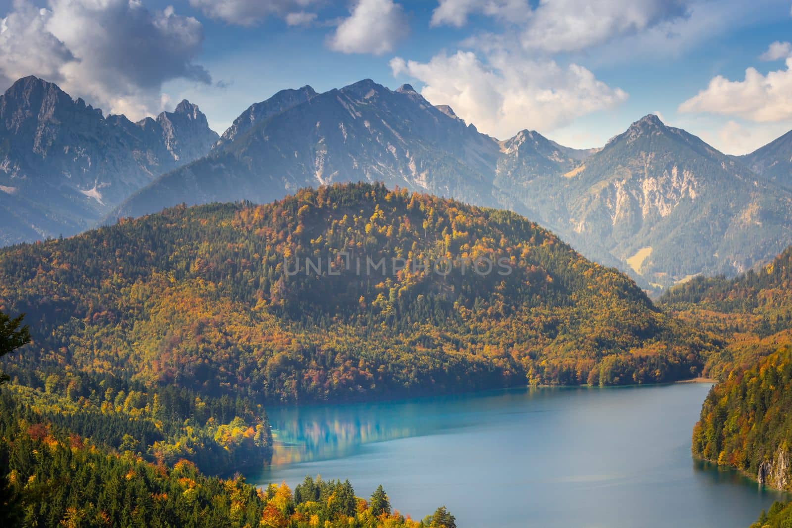 Alpsee Lake reflection in Bavarian alps at golden autumn, Karwendel mountains, Bavaria, Germany border with Austria