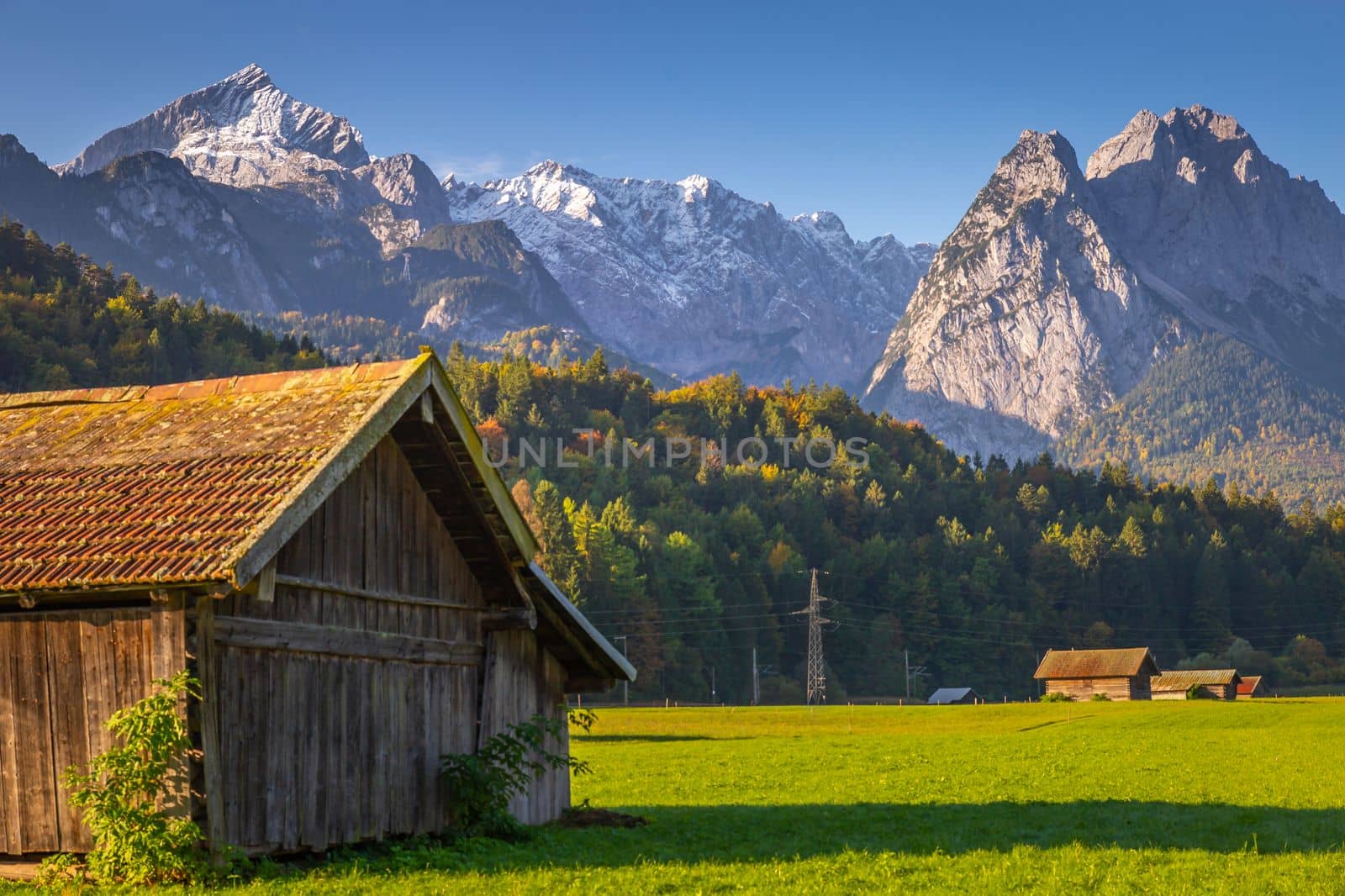 Bavarian alps and rustic farm barns, Garmisch Partenkirchen, Zugspitze massif, Bavaria, Germany