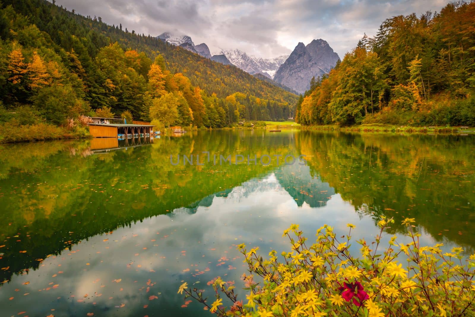 Riessersee alpine turquoise lake reflection at sunrise, Garmisch, Bavarian alps, Germany