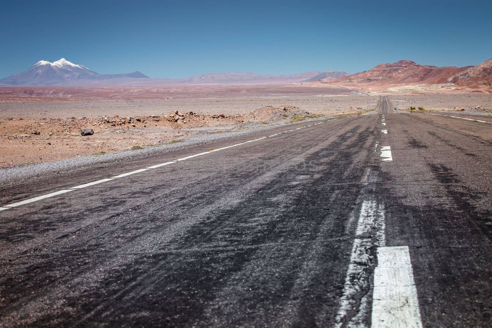 Road in Peaceful Moon Valley dramatic landscape at Sunset, Atacama Desert, Chile