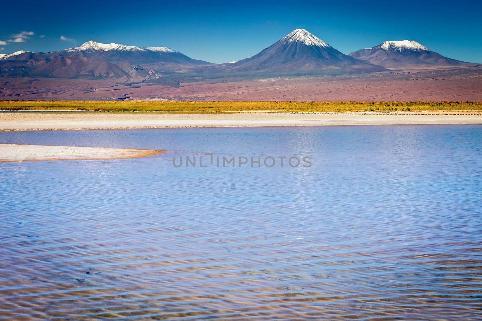 Licancabur and Peaceful reflection lake with dramatic volcanic landscape at Sunset, Atacama Desert, Chile