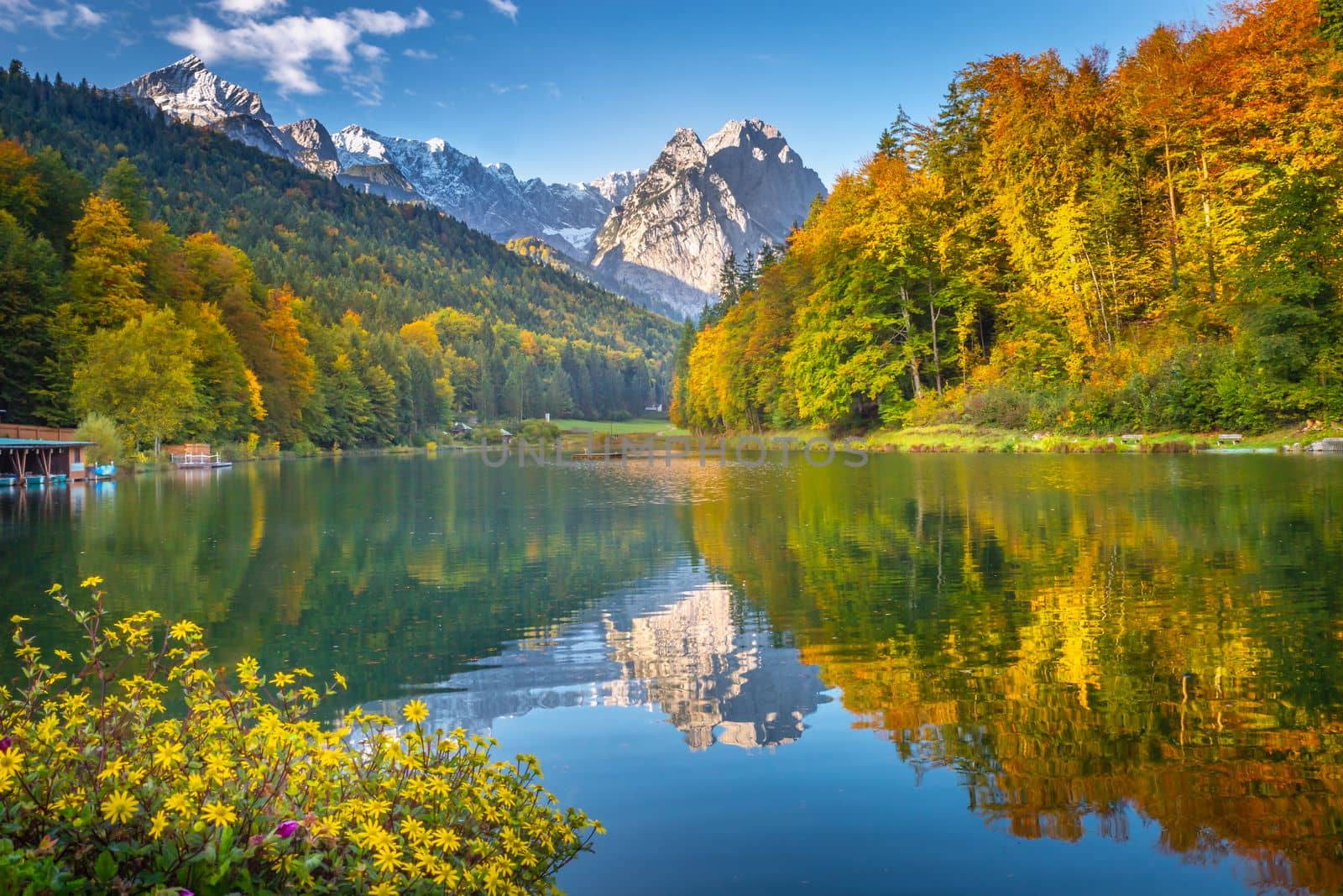 Riessersee alpine turquoise lake reflection at sunrise, Garmisch, Bavarian alps, Germany