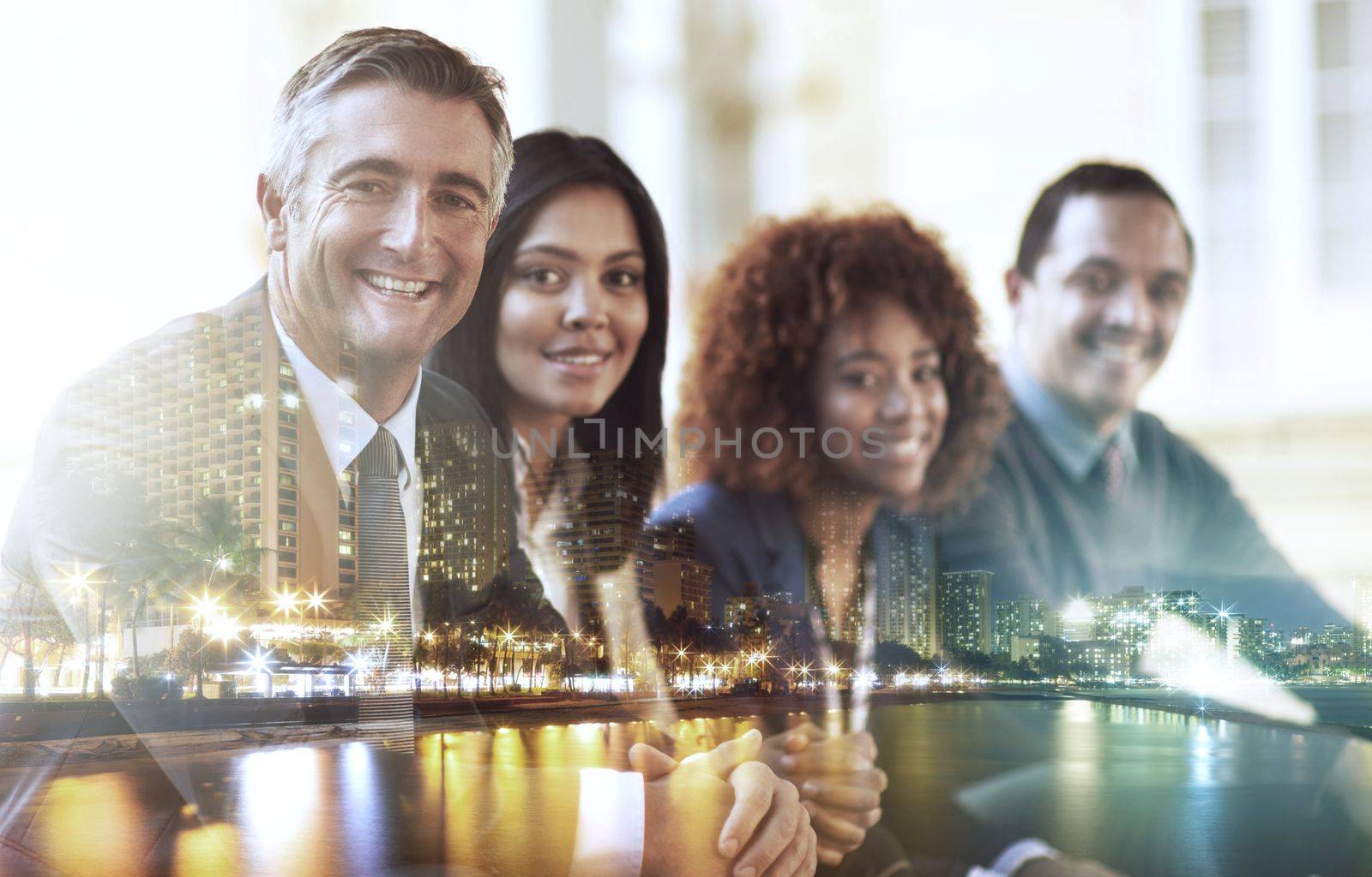 The faces of new business. Multiple exposure shot of businesspeople superimposed over a cityscape. by YuriArcurs