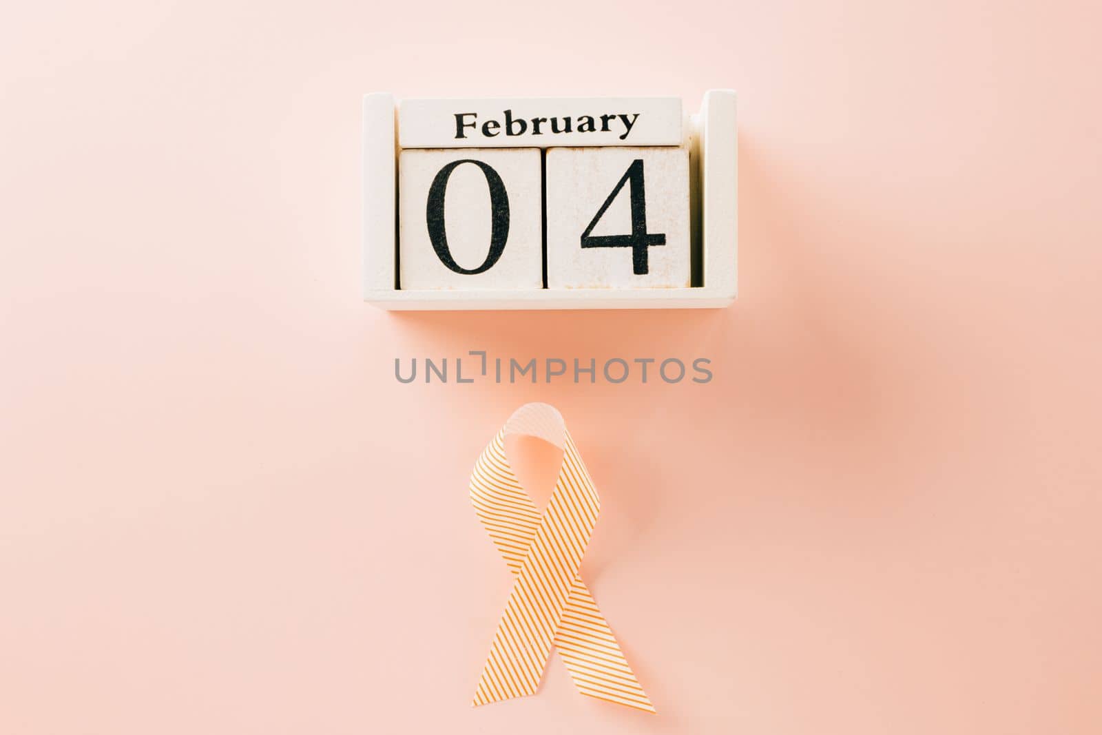 Pink awareness ribbon sign and Calender 4 February of World Cancer Day campaign by Sorapop