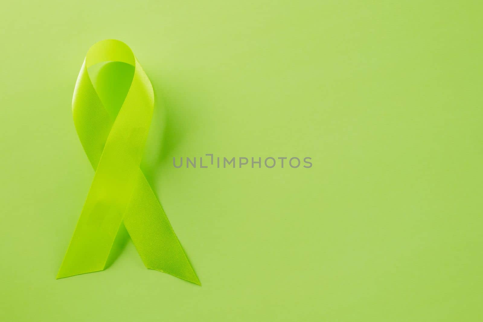 Green awareness ribbon of Gallbladder and Bile Duct Cancer month by Sorapop
