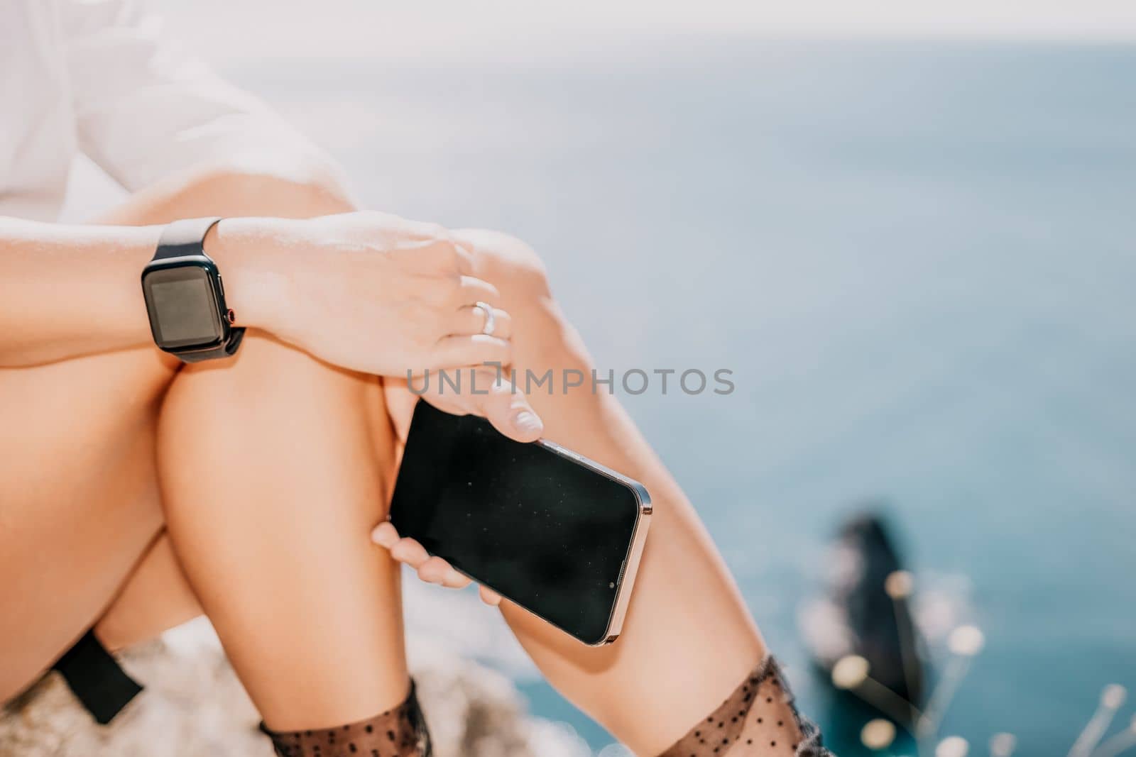 Happy girl doing yoga with laptop working at the beach. beautiful and calm business woman sitting with a laptop in a summer cafe in the lotus position meditating and relaxing. freelance girl remote work beach paradise