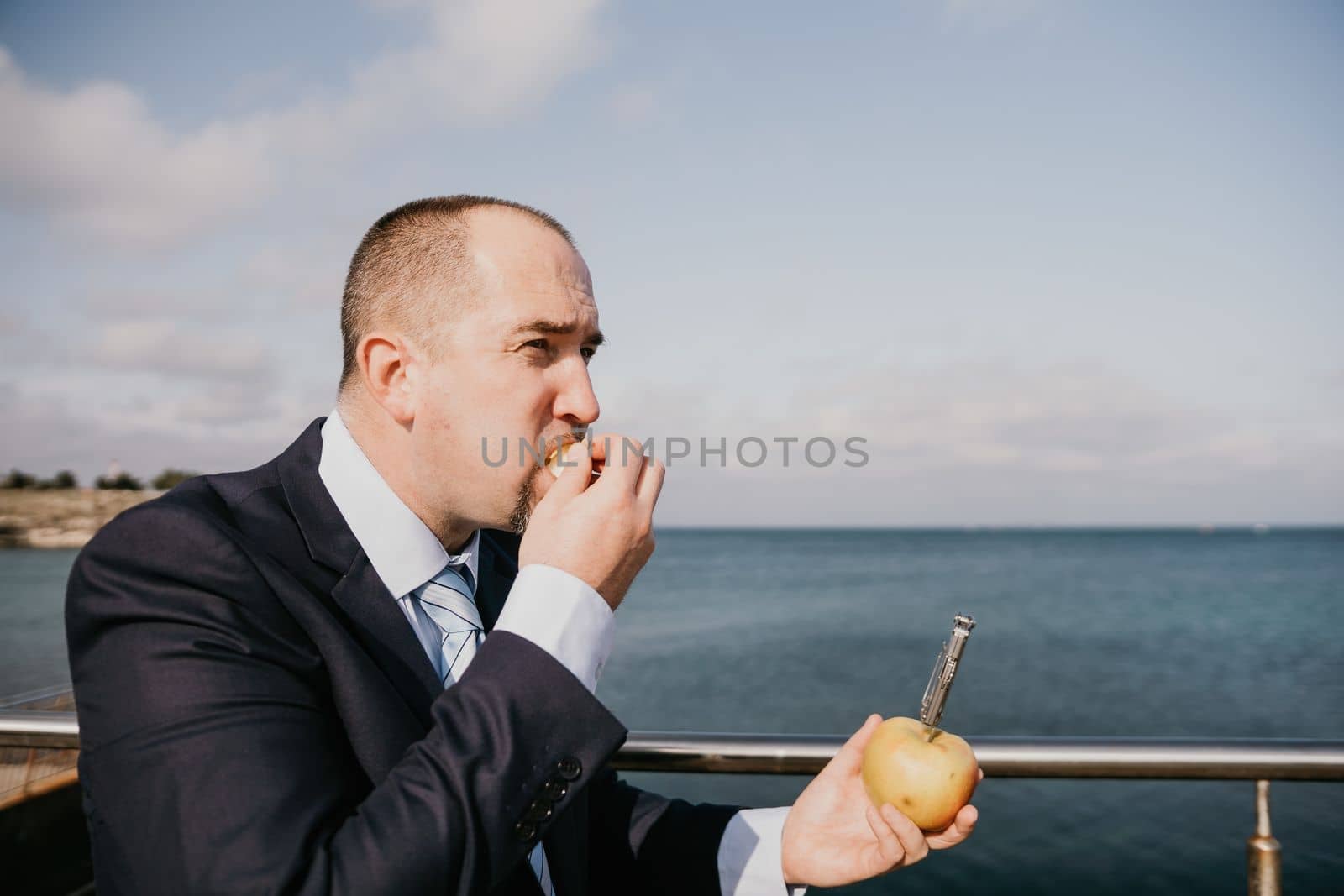 Young business people eating golden apples in lunch time discussing phone calls