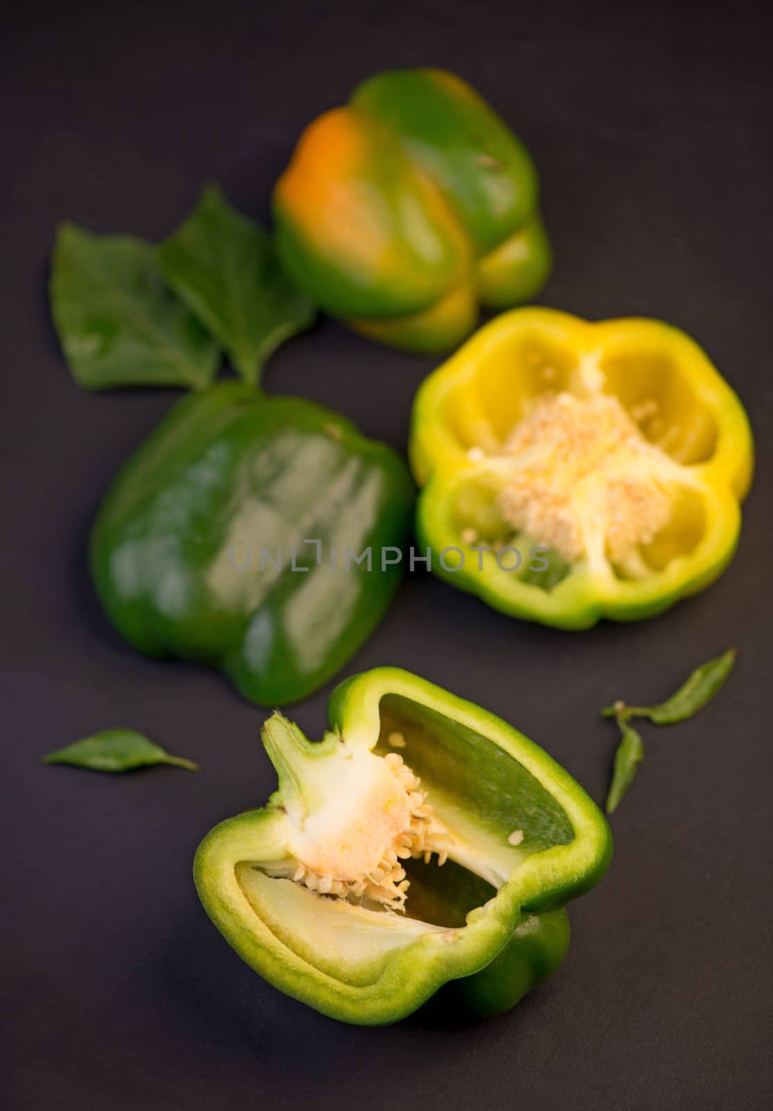 sweet pepper, green bell pepper on black background, full depth of field by aprilphoto