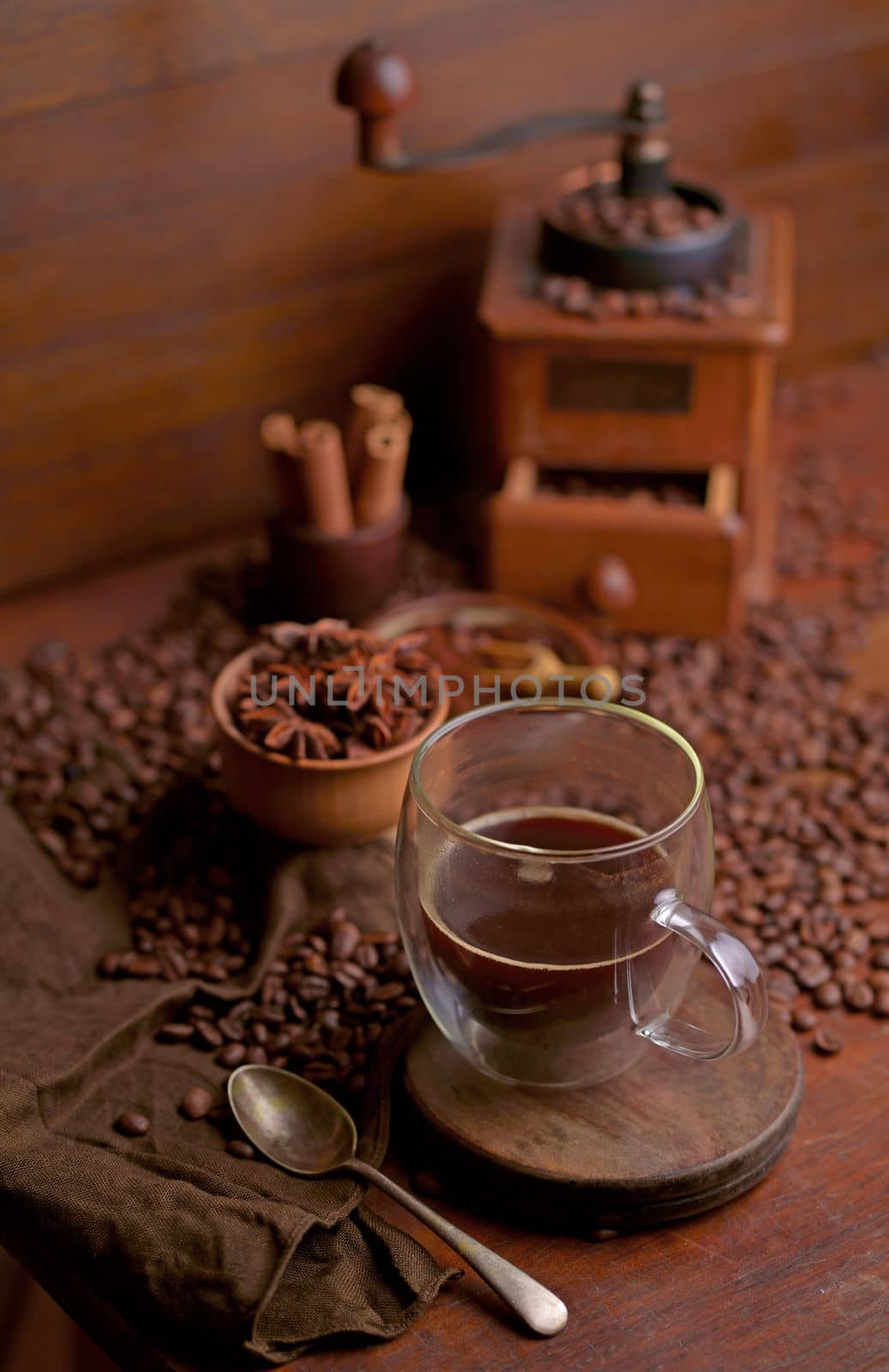 Tasty steaming espresso in cup with coffee beans. View from above.