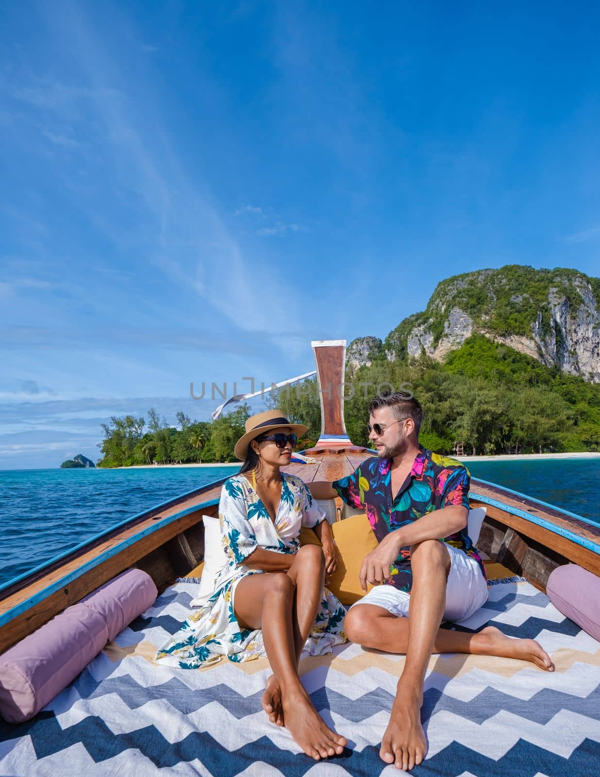 Longtail boat in Krabi Thailand, couple man, and woman on a trip at the tropical island 4 Island by fokkebok