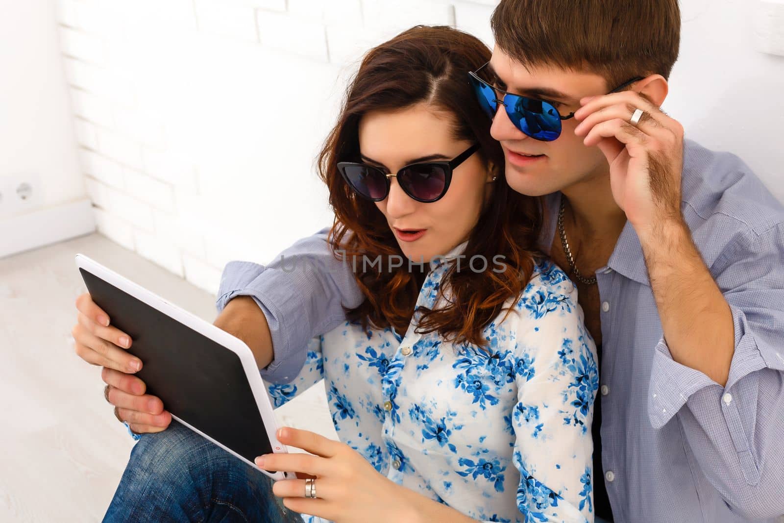 Happy young couple doing shopping on internet