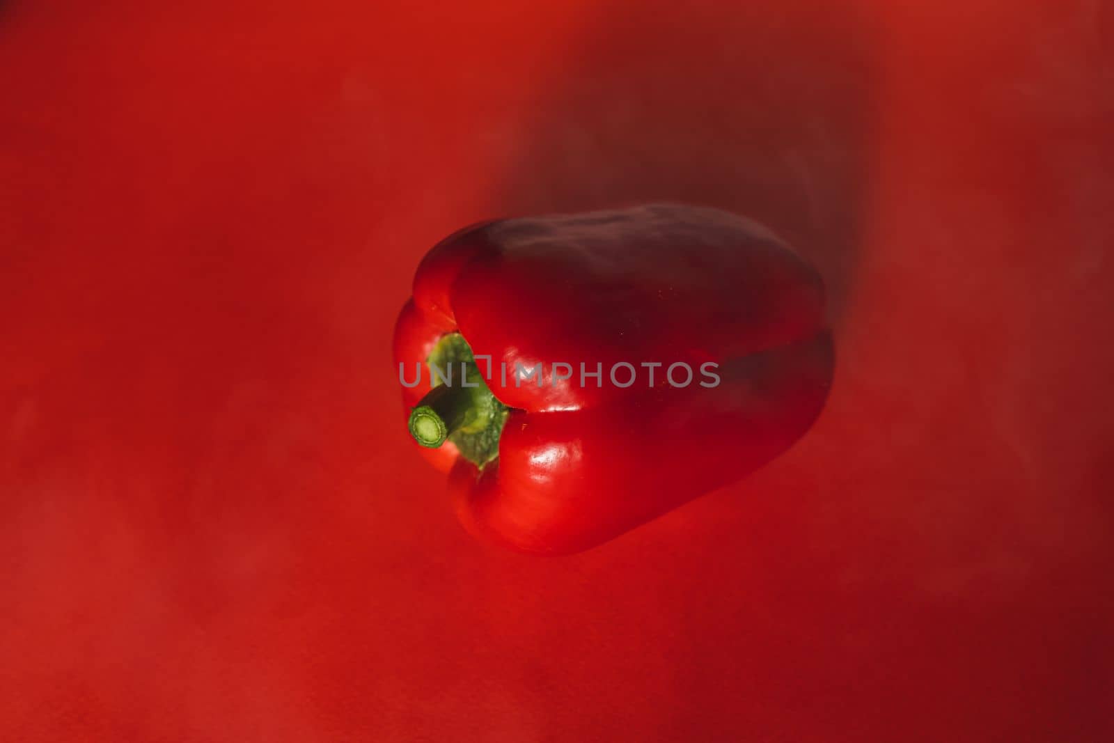 SWEET PEPPER ON A RED BACKGROUND.