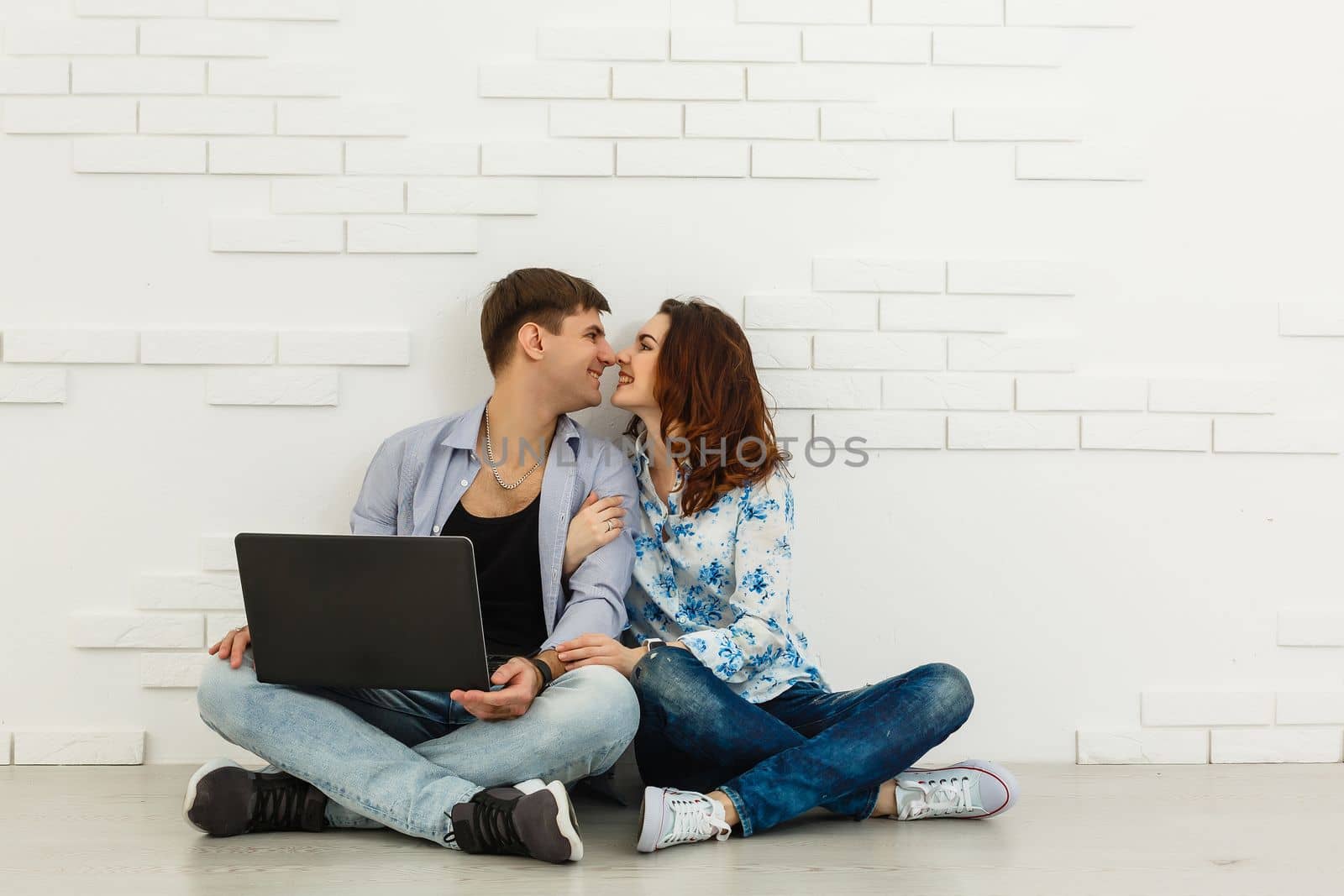 Nice portrait of couple with laptop.