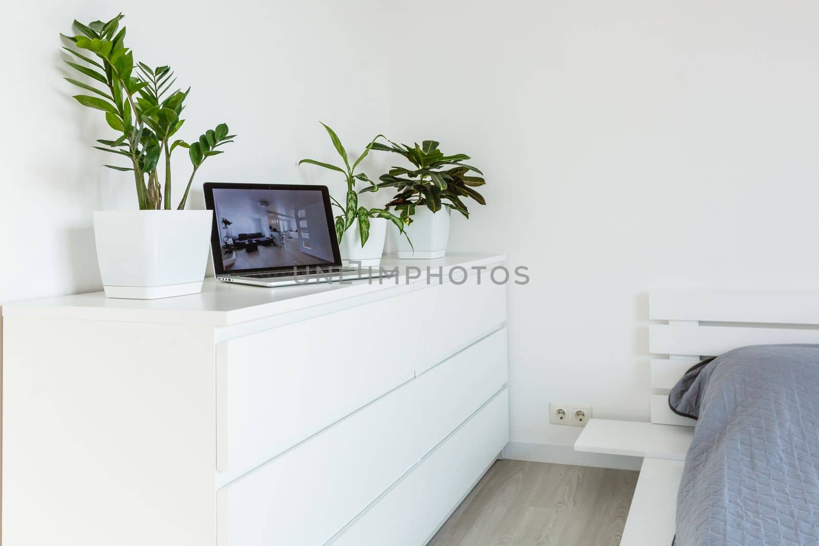 office tabletop with tablet, laptop showing cool hotel responsive design website by Andelov13