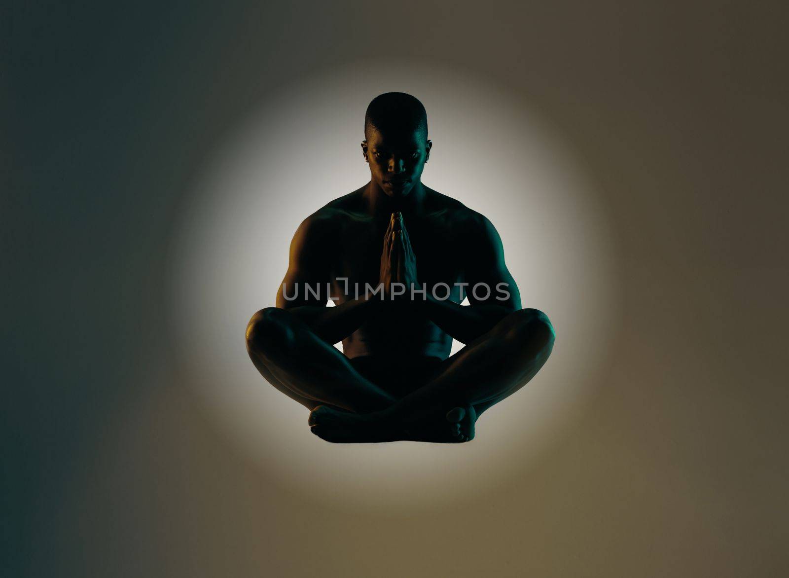 Meditation art, silhouette or relax man meditate for spiritual mental health, chakra energy balance or soul healing. Zen mindset peace, mindfulness or shadow model float isolated on studio background by YuriArcurs
