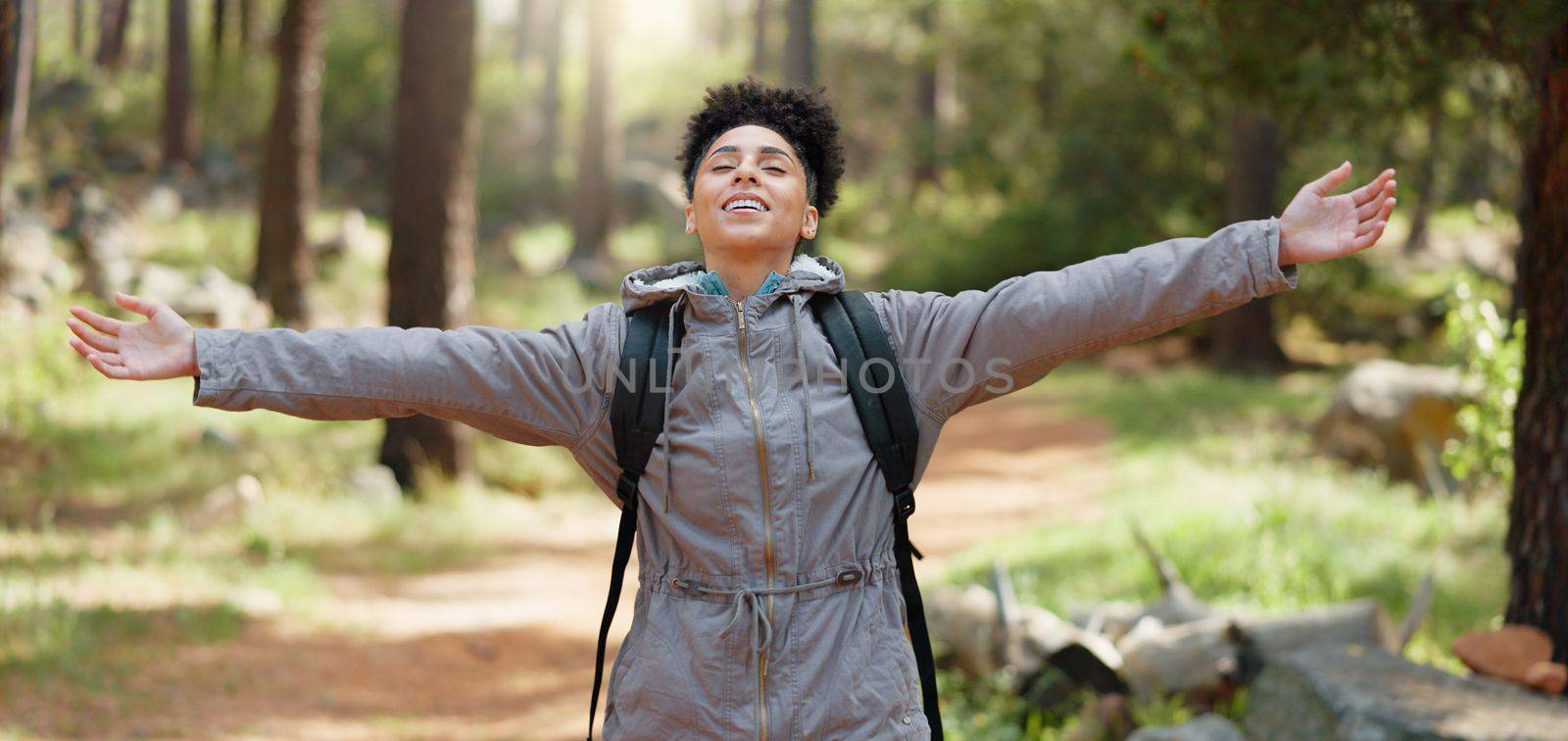 Beauty, sunshine and freedom for girl hiking in nature forest or woods for peace, fitness exercise or training workout. Travel adventure, wellness journey or black woman trekking in Amazon Rainforest.
