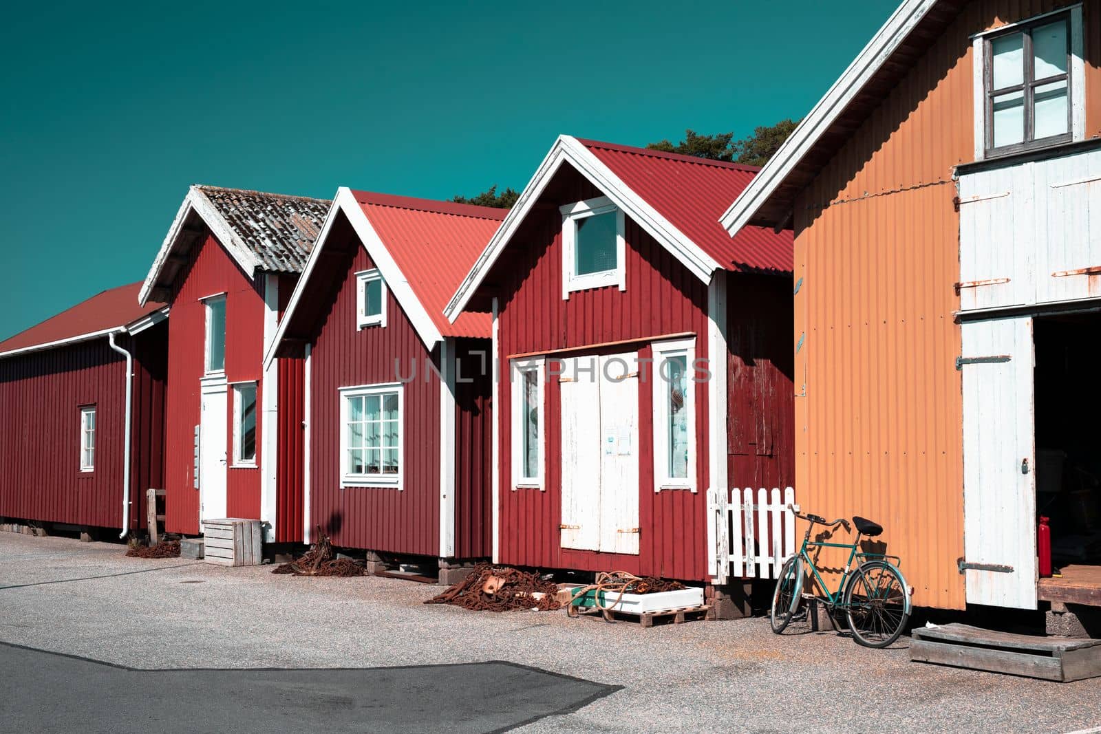 Colorful traditional fisherman huts, boathouses in row small harbor. Storage for fishing or rented as Holiday cottage summer