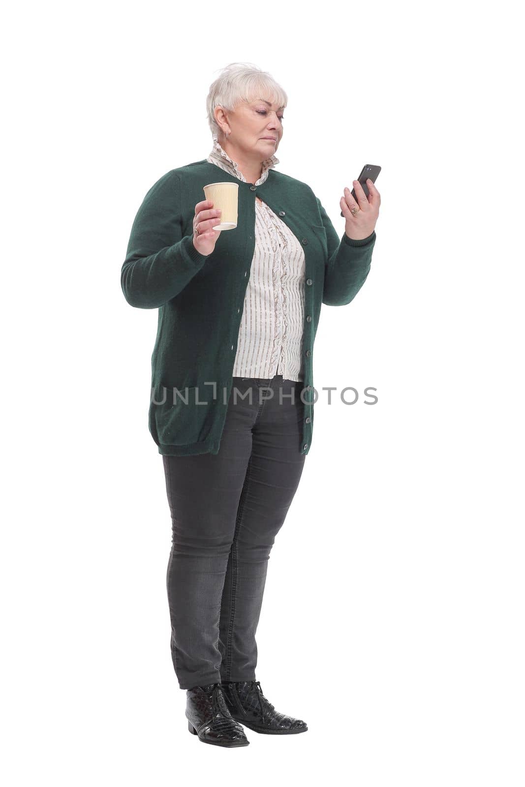 Front view of senior woman with smartphone and coffee. by asdf