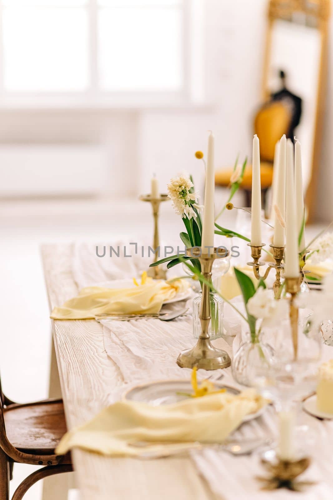 Beautiful Easter table setting with floral decor indoors