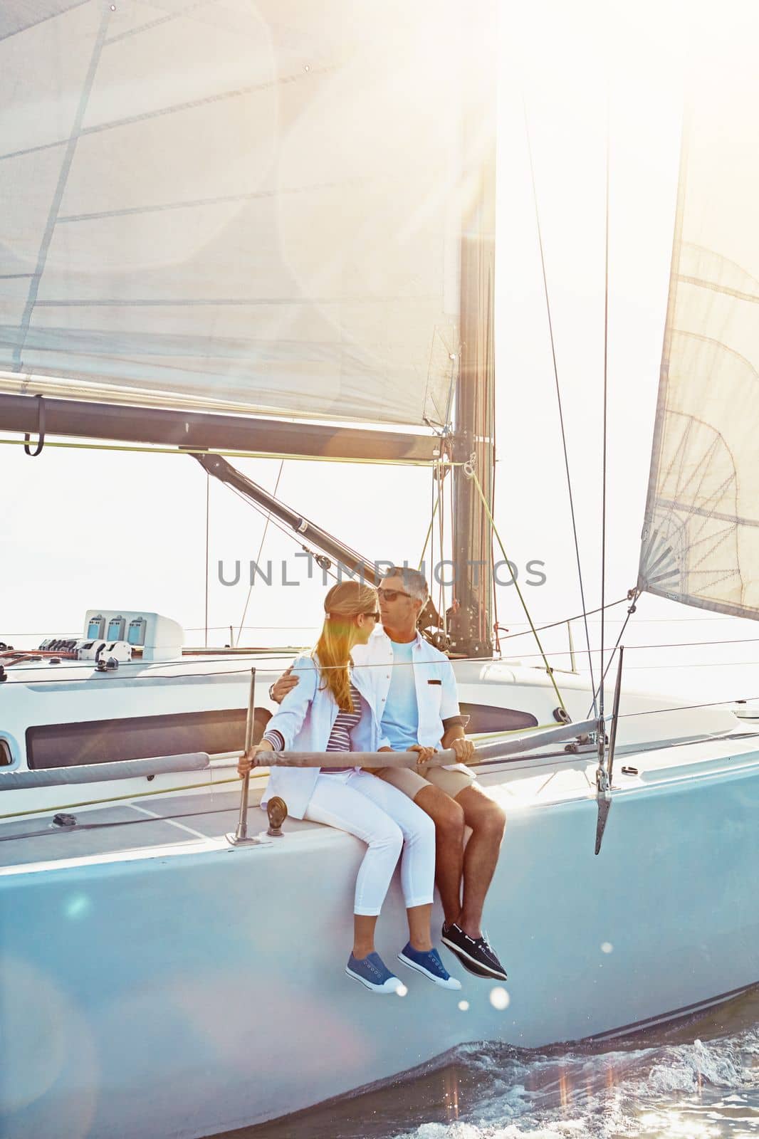 Relax, travel and luxury with couple on yacht for summer, love and sunset on Rome vacation trip. Adventure, journey and vip with man and woman sailing on boat for ocean, tropical and honeymoon at sea by YuriArcurs