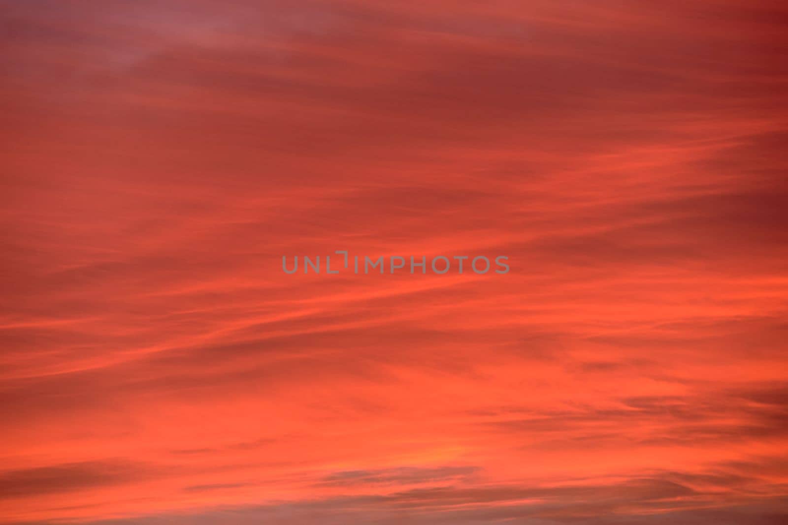 Sky light after sunset. orange background, clouds by raul_ruiz