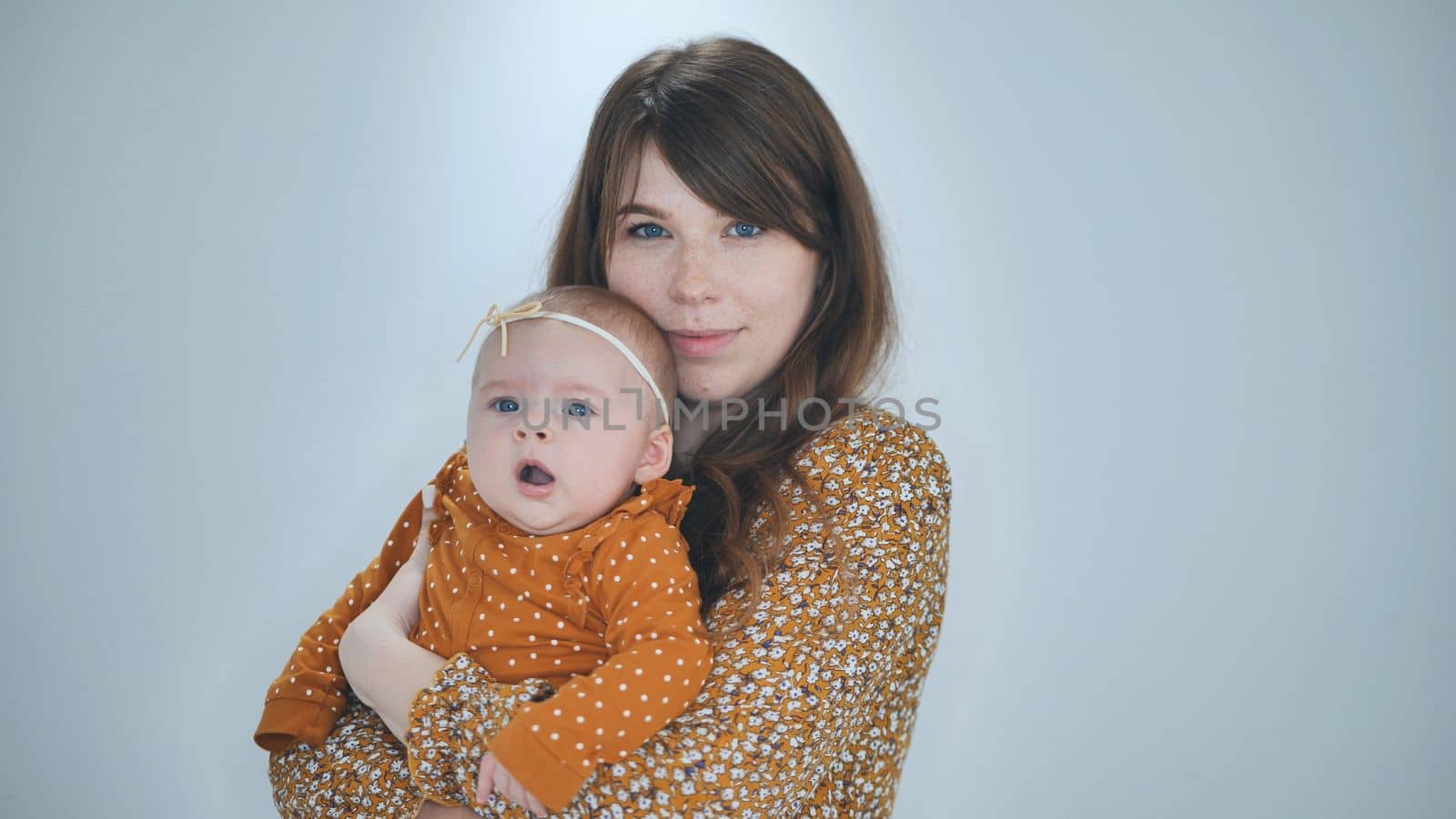 A loving mother with her child against a sulfur background. by DovidPro