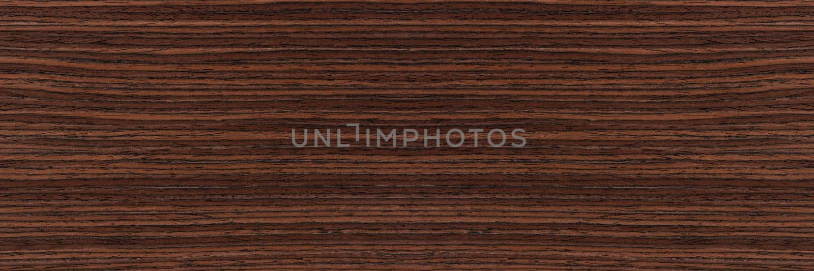 Rosewood texture. Texture of dark mahogany with an intense pattern, natural rosewood veneer for the production of furniture or yacht decoration.