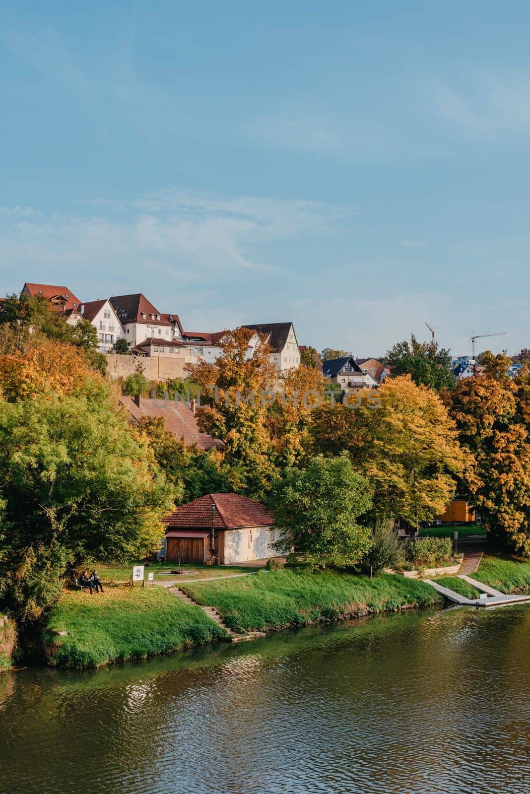 Autumn Landscape - River And Shores With Trees, Bushes And City Houses Marbach Am Neckar. Panoramic Aerial View Of The River In A City Park. Deciduous Trees, Golden Leaves. Autumn Landscape. Ecology, Pollution And Environmental Conservation, Fresh Air Themes. Marbach Am Neckar Is A Town About 20 Kilometres North Of Stuttgart. It Belongs To The District Of Ludwigsburg, The Stuttgart Region And The European Metropolitan Region Of Stuttgart. by Andrii_Ko