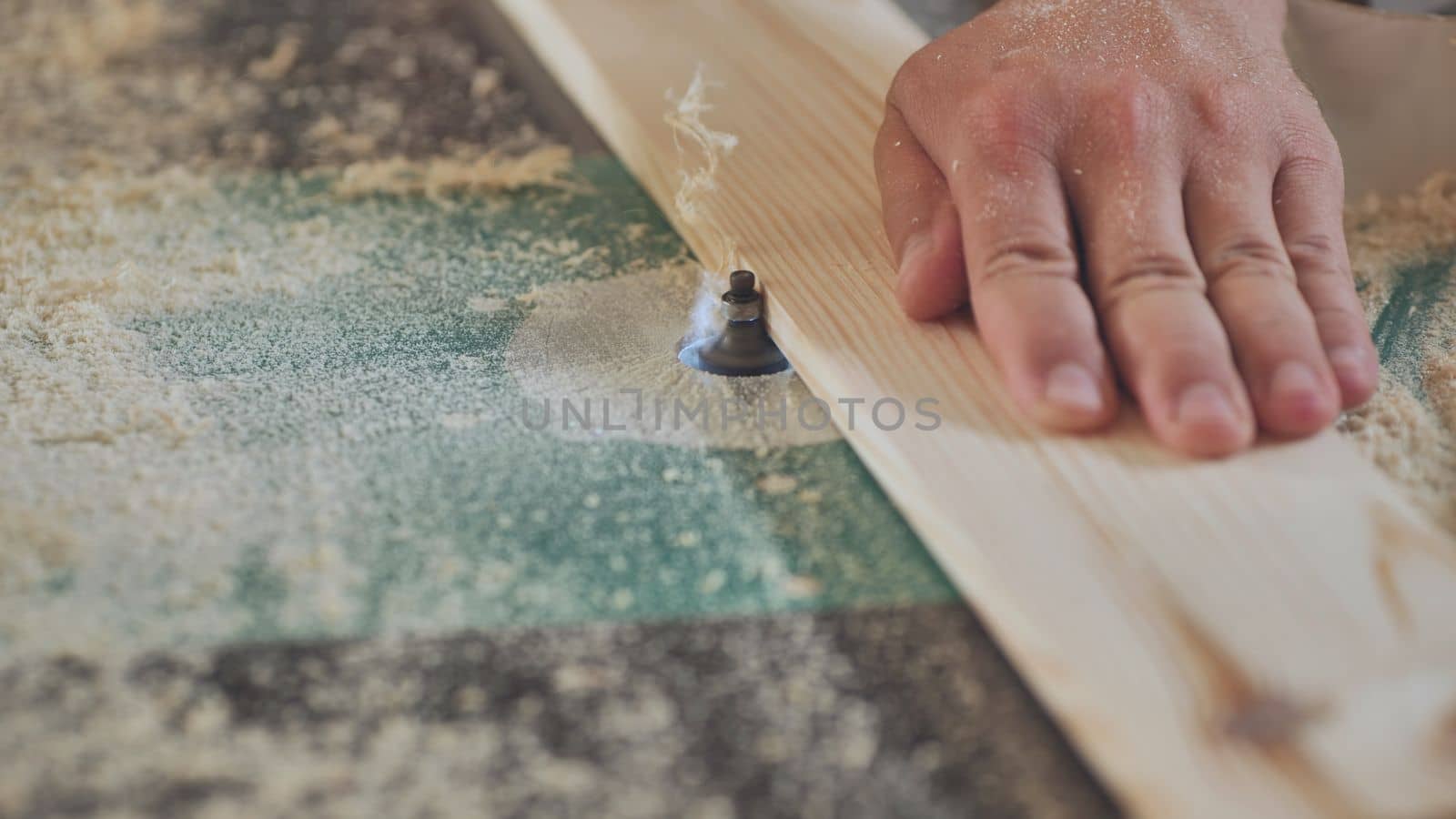 The milling machine processes the board