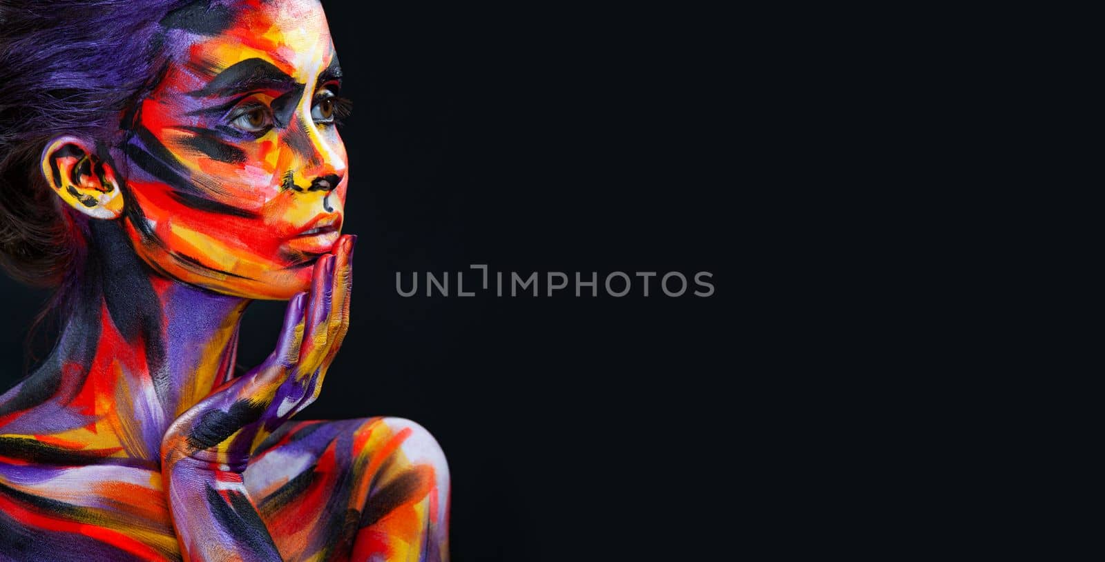 Portrait of the beautiful girl with art colorful make-up and bodyart. Download a picture with free space for text. Mockup for a music album. Cover design for e-book. Abstract image by MikeOrlov