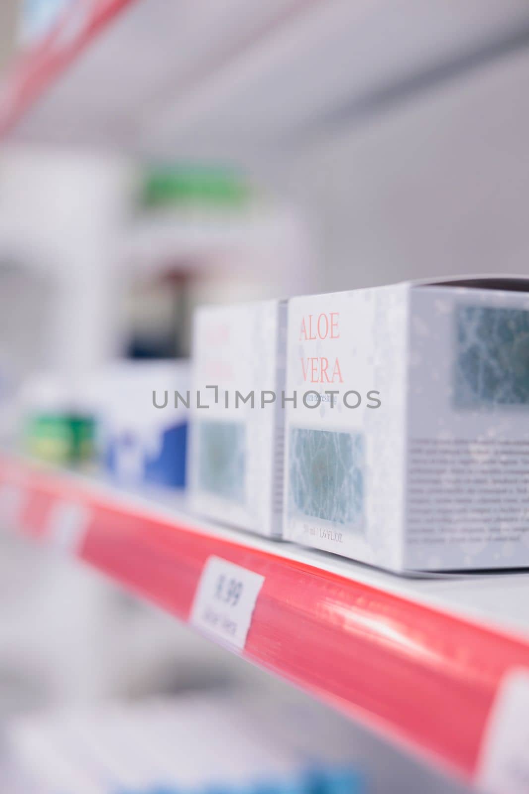 Drugstore shelves stocked with various medicinal products and aloe vera cream ready for clients by DCStudio