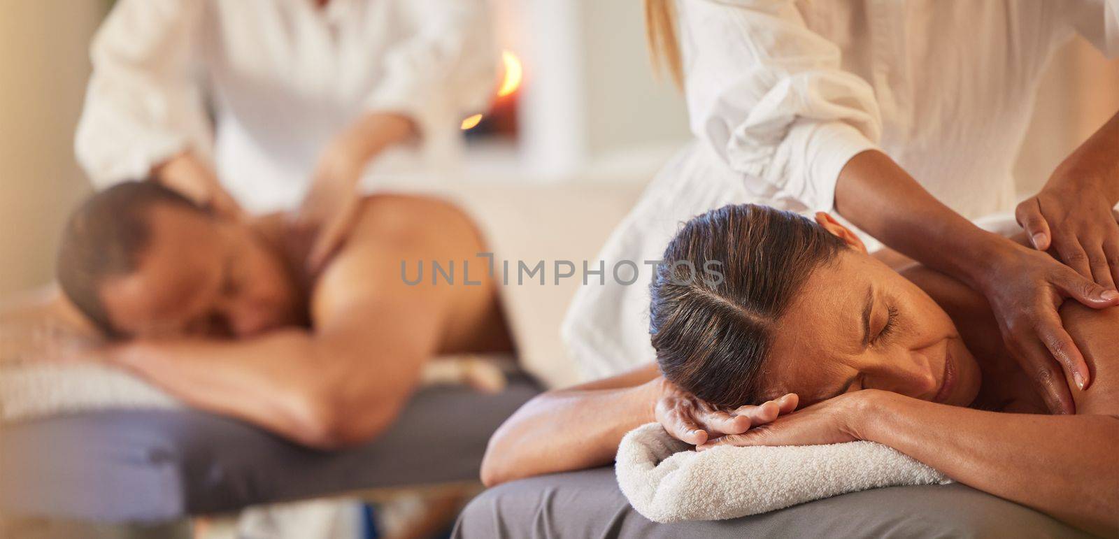 Massage, relax and peace with couple in spa for healing, health and zen treatment. Detox, skincare and beauty with hands of massage therapist on man and woman for calm, physical therapy and luxury.