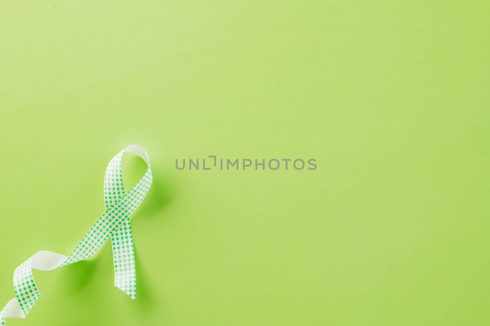 Green awareness ribbon of Gallbladder and Bile Duct Cancer month by Sorapop