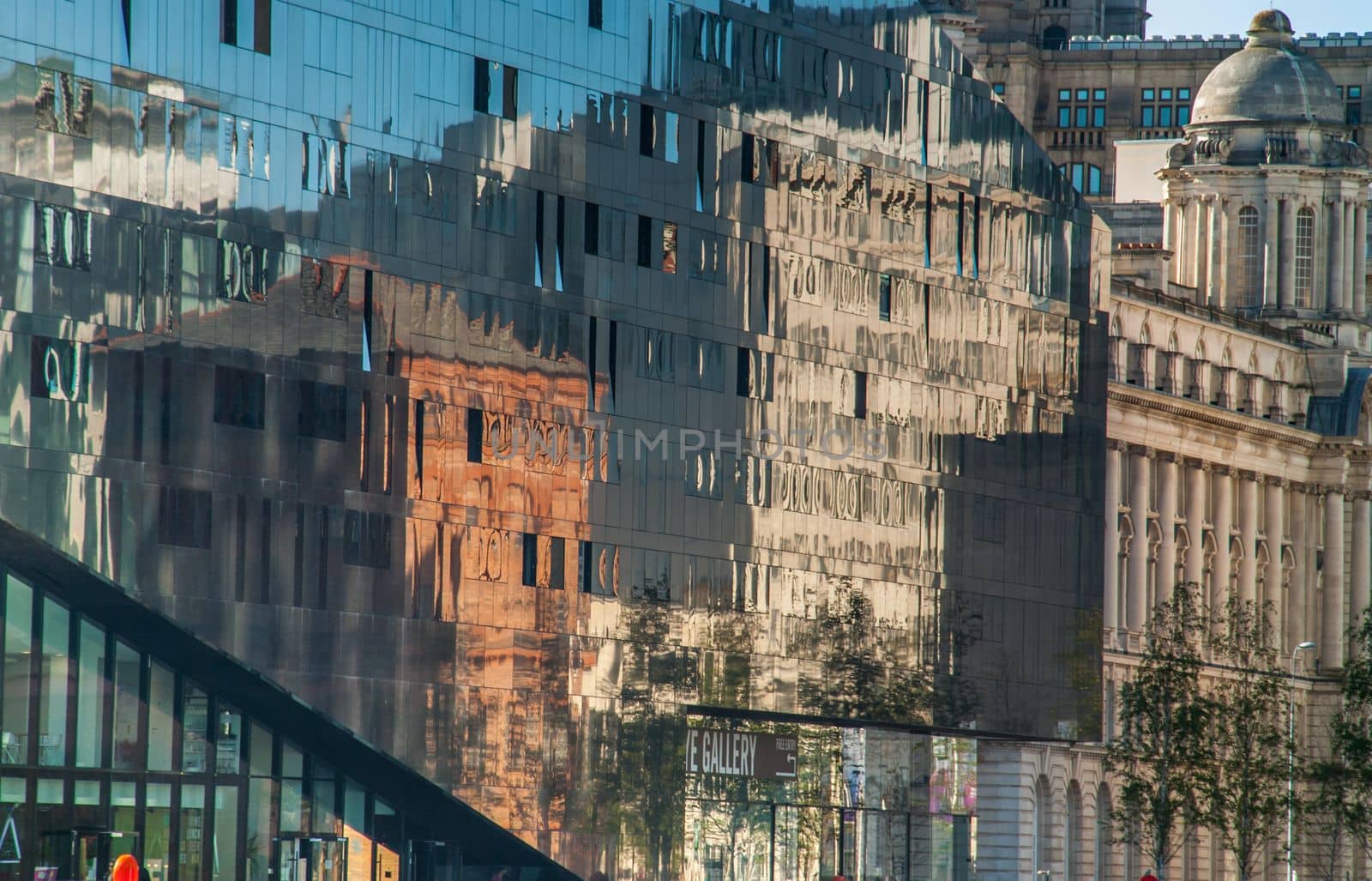 building reflected on glass facade wall of building Beautiful and strange patterns. Architecture concept.