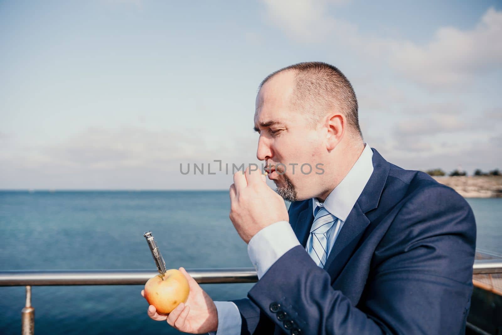 Young business people eating golden apples in lunch time discussing phone calls