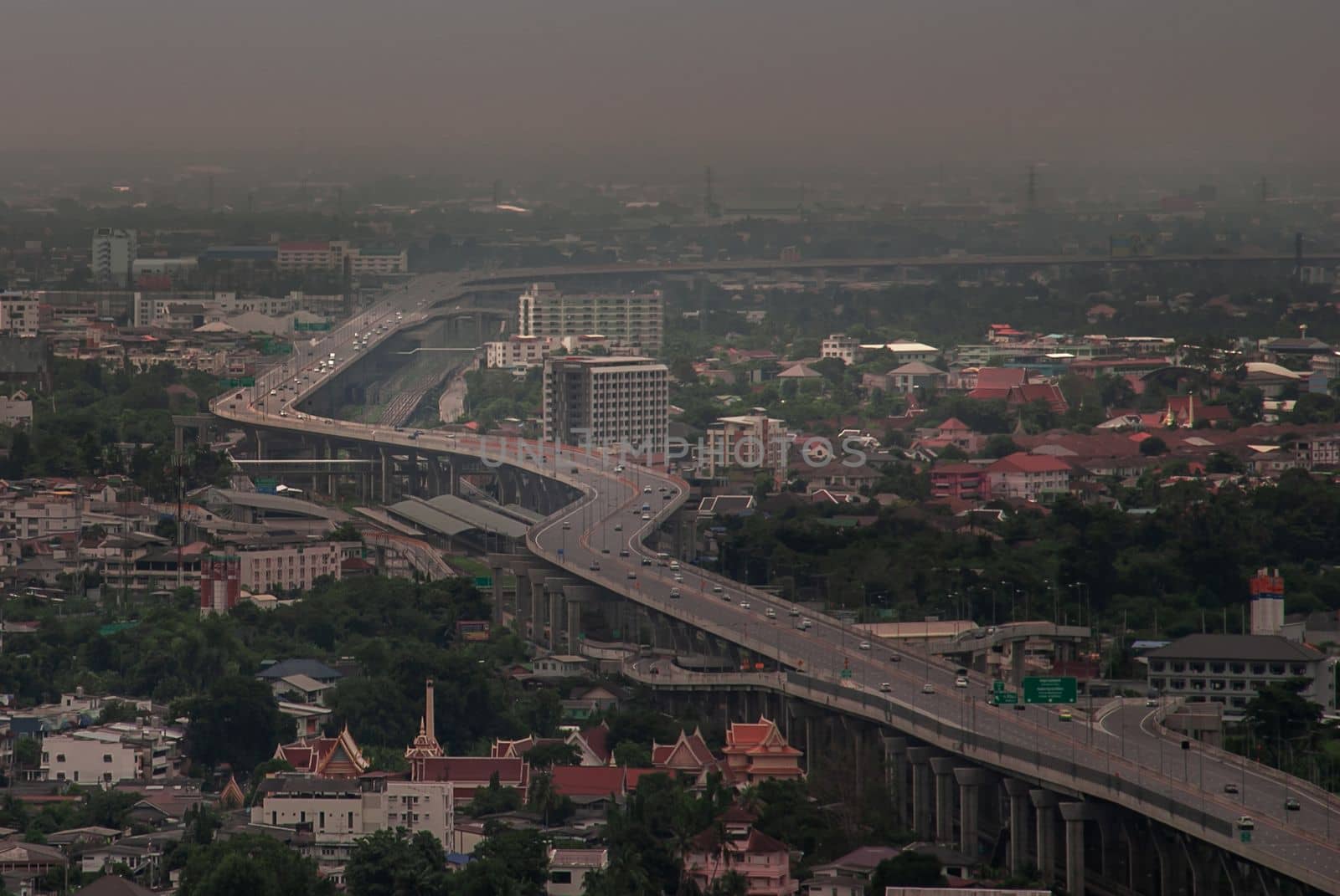 Bangkok, Thailand - Oct 05, 2019 : Aerial view of cars driving on highway junctions. Bridge roads with green garden and trees in connection of architecture concept. Top view. Urban city.
