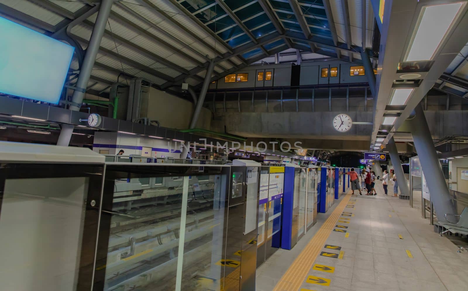 The people on Tha Phra BTS Skytrain Station of the central business district of Bangkok.  by tosirikul