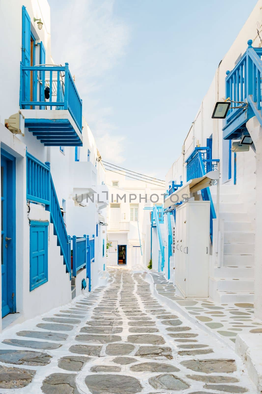 empty street of Mykonos Greek village in Greece, colorful streets of Mikonos village.